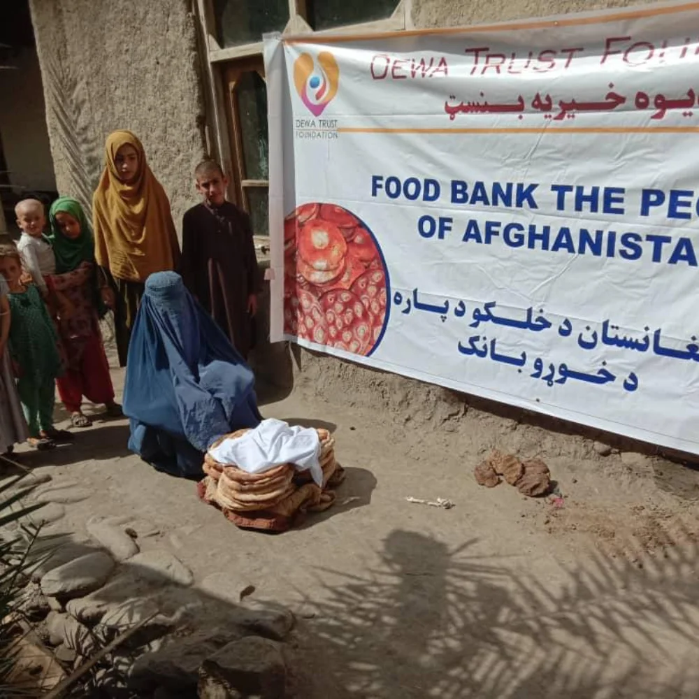 Children beside fresh bread at a food distribution